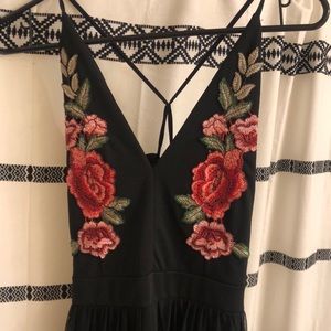 Women’s romper with rose accents